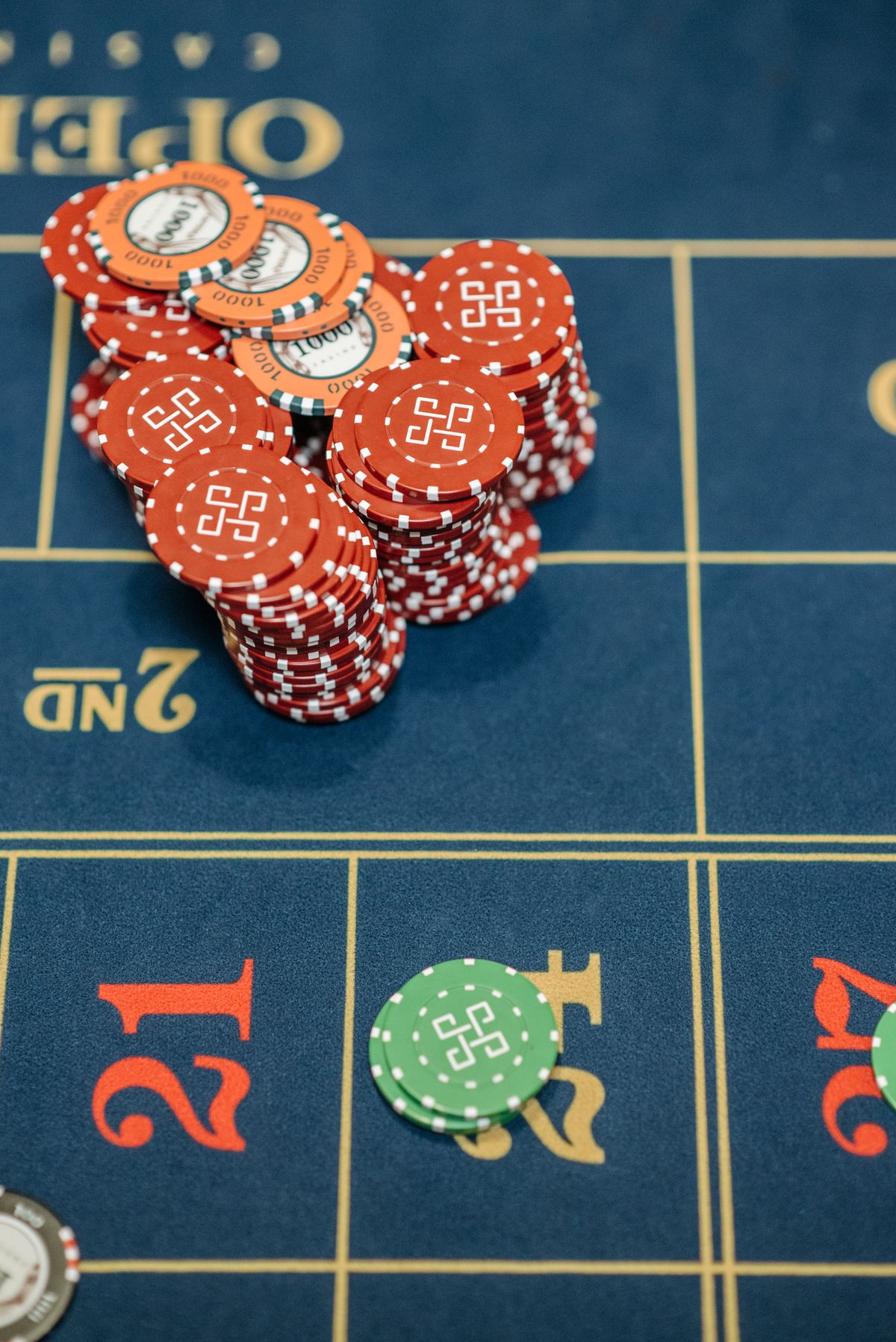 Dealer shuffling cards at the casino table